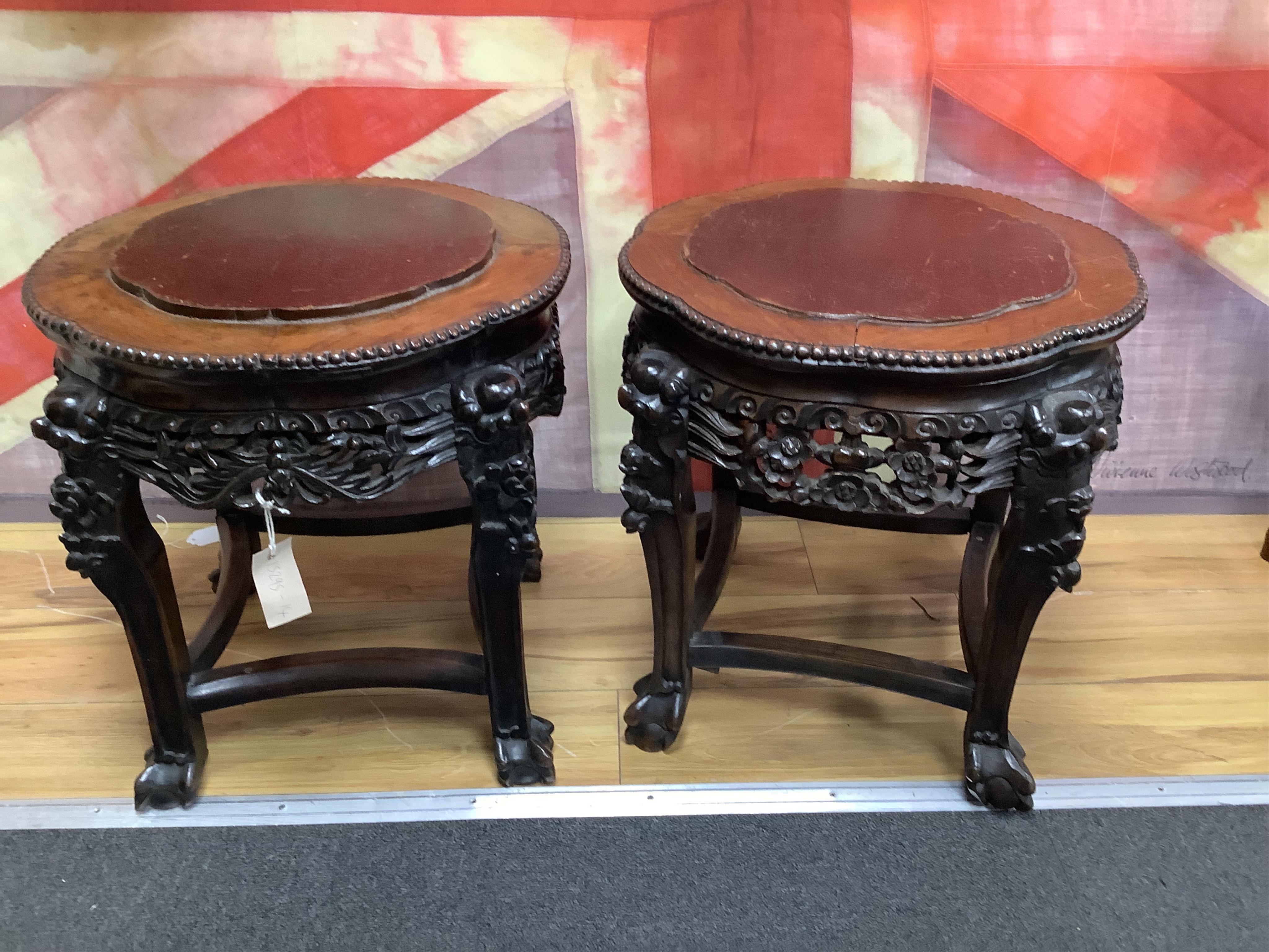 A pair of Chinese circular jardiniere stands with wood inset tops, diameter 46cm, height 46cm. Condition - fair